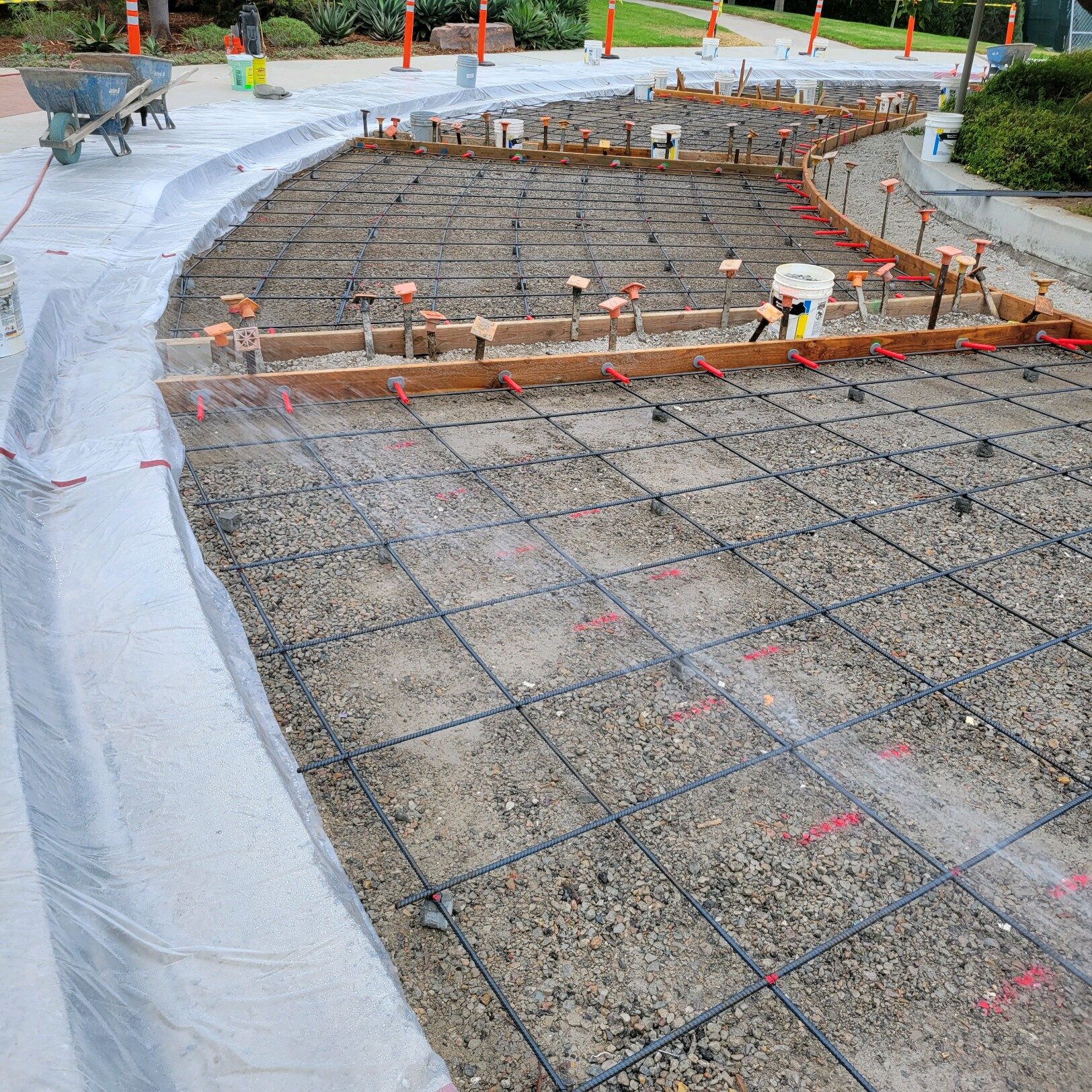 Construction rebar formwork for curved walkway, KSW project oversight