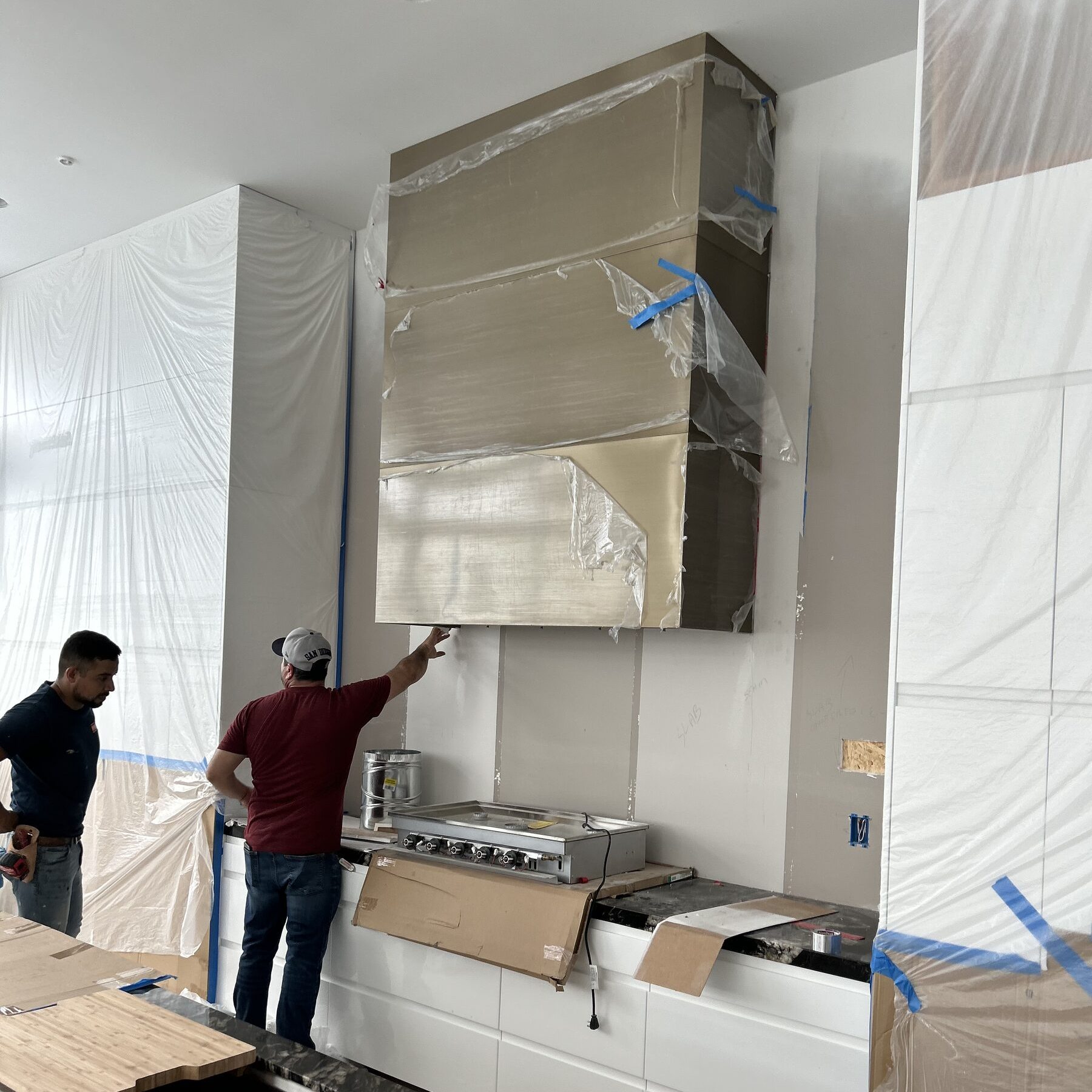 Kitchen range hood install progress, KSW Construction Management