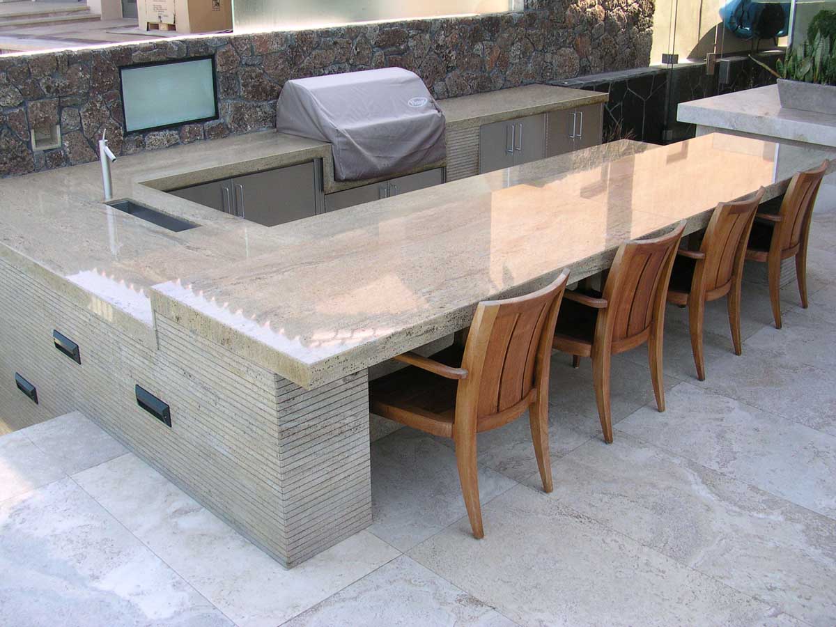 Outdoor kitchen with travertine bar and grill