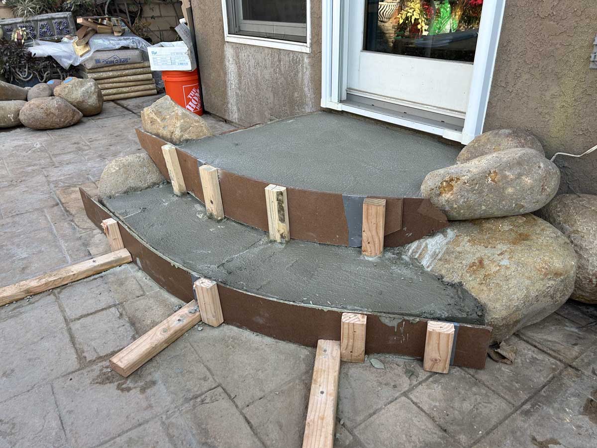 Curved concrete entry steps during pour