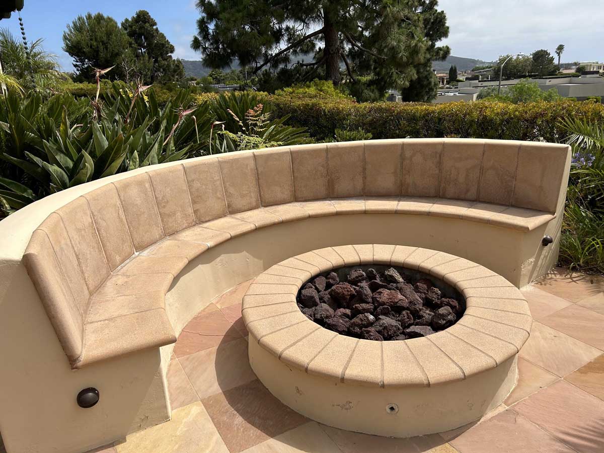 Flagstone fire pit with curved bench seating
