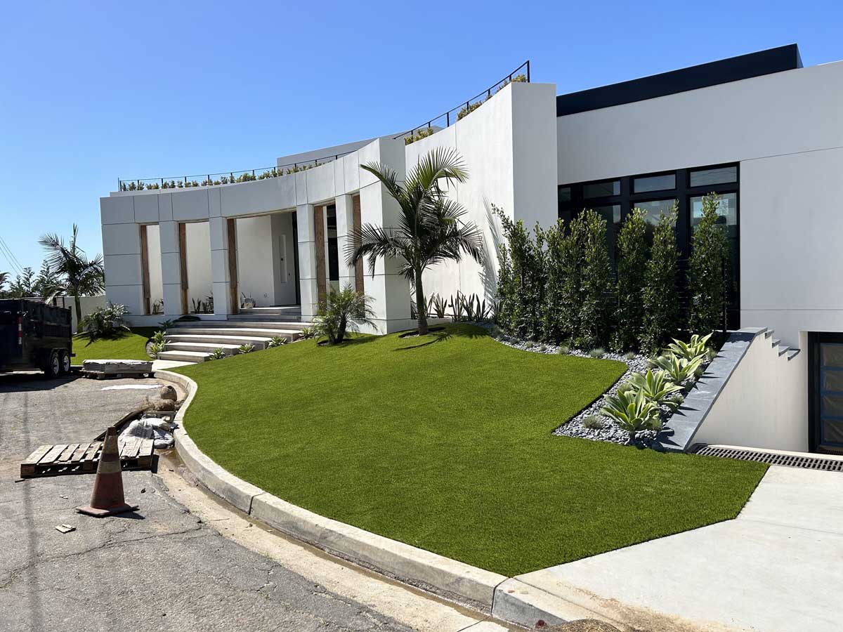Completed modern facade with turf lawn