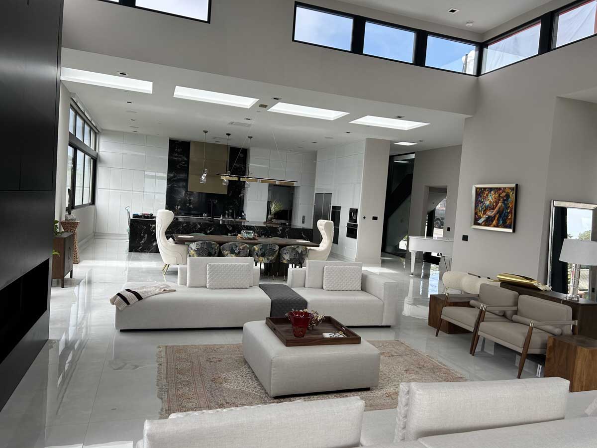 Great room with black marble kitchen