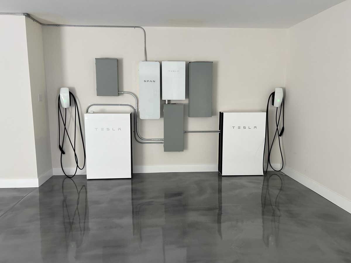 Tesla Powerwall and EV charger in garage