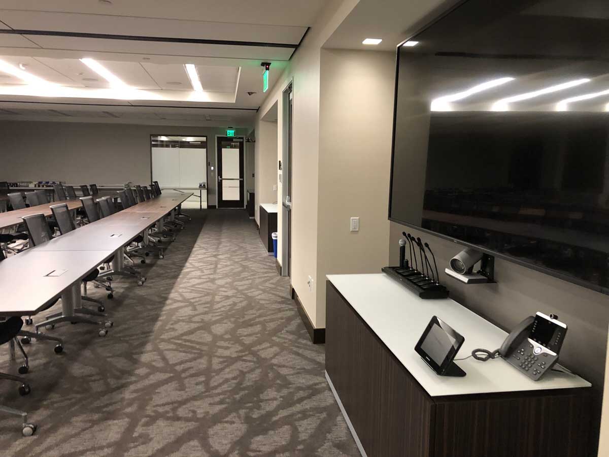 Conference room with AV credenza and corridor view