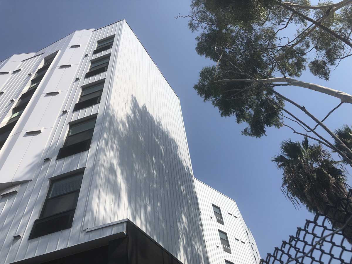 Affordable housing midrise facade looking upward